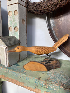 Naive Carved Bird on a Log